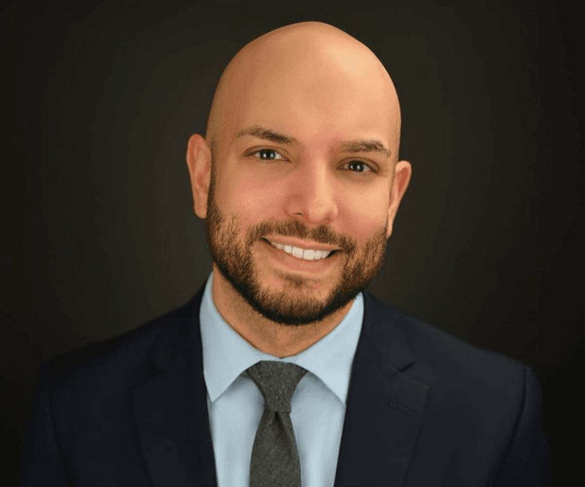 Professional headshot after bald filter showing clean bald look