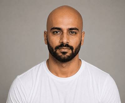 Portrait after AI head hair removal showing clean bald scalp