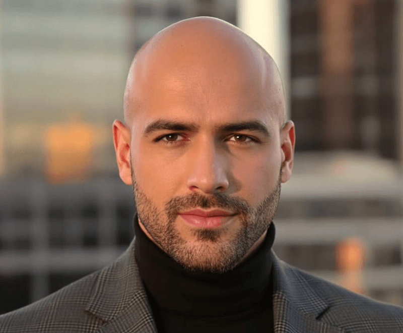 Portrait after AI buzz cut preview showing short shaved style
