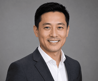 Professional headshot after AI teeth brightening with polished smile